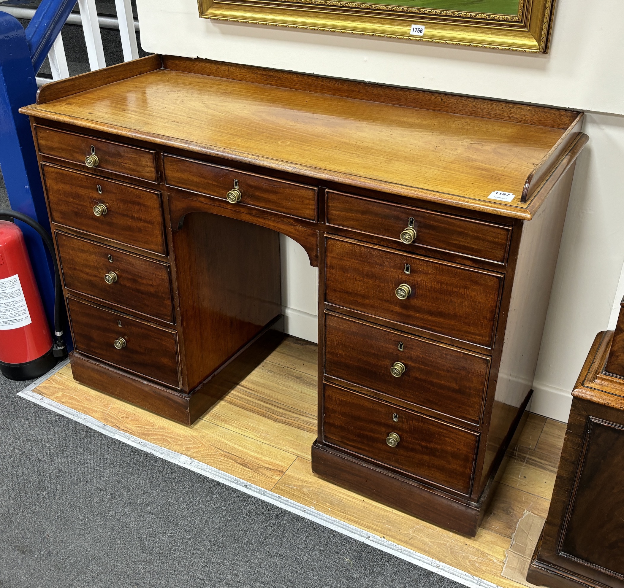 An early 19th century mahogany kneehole dressing table, width 121cm, depth 51cm, height 85cm